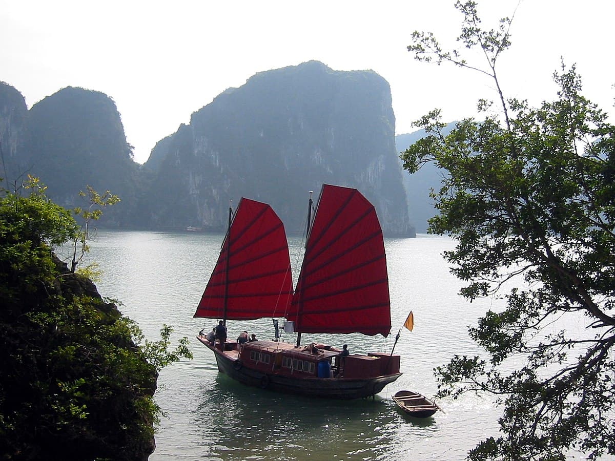 Junk boats in Ha Long Bay at sunset