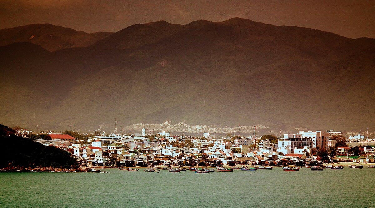 Nha Trang Bay crescent beach and high-rises viewed from a hillside