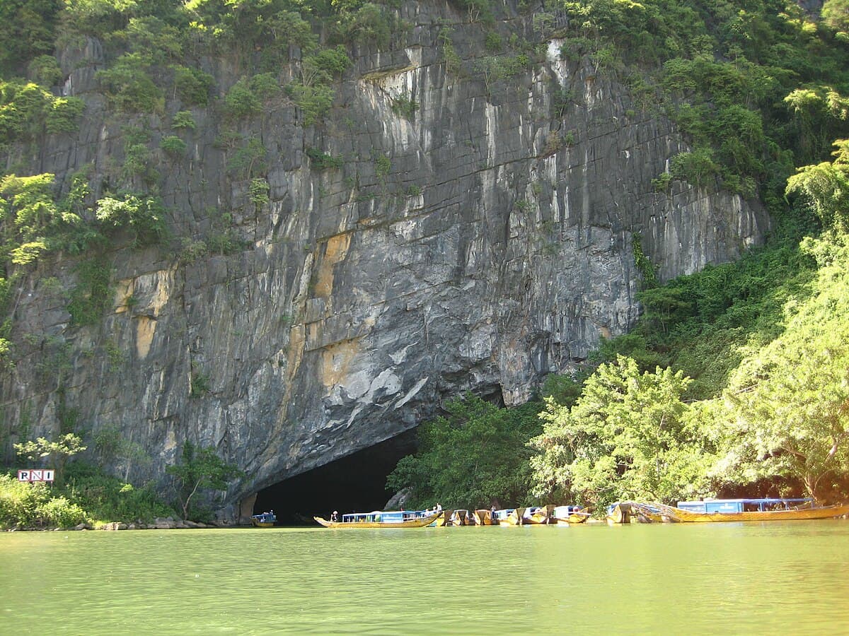 Boats on the river entering Phong Nha Cave in Phong Nha-Ke Bang National Park