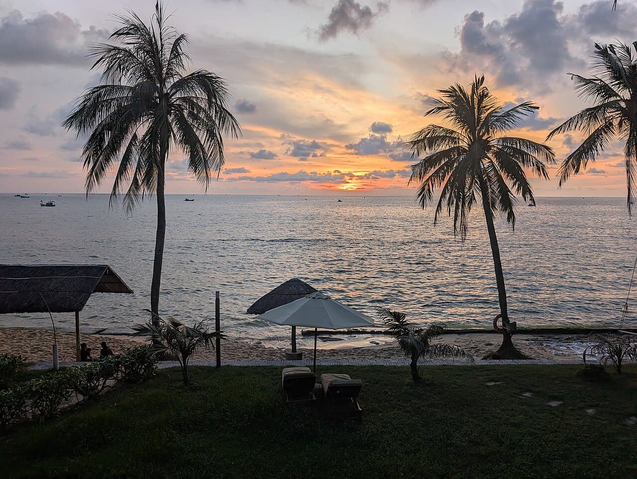 Phu Quoc beach with Bamboo Airways plane in the distance
