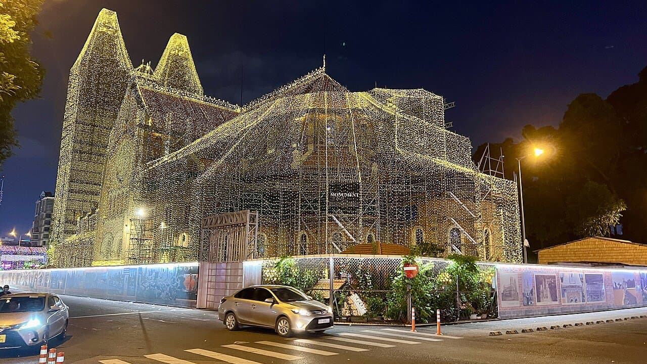 Saigon Notre-Dame Cathedral lit at night in central Ho Chi Minh City — the French-colonial landmark at the heart of District 1