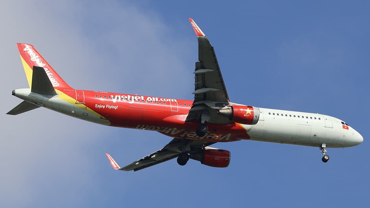VietJet Air aircraft on the tarmac at Tan Son Nhat airport in Ho Chi Minh City with the typical yellow-and-red livery